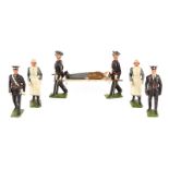 A rare set of Britains St. John Ambulance Stretcher Party from set No.1426. Comprising Officer,