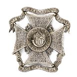An OR’s darkened WM busby badge of The 60th King’s Royal Rifle Corps, GC (minor wear). Plate 5