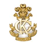 A good OR’s 2nd pattern cap badge of the King’s Colonials, POW’s feathers, KC monogram and motto