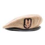 A WWII officer’s tan cloth beret of the Special Air Service, padded embroidered badge, Moss Bros