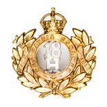 A scarce OR’s bi-metal cap badge of the 18th Hussars, “18/H” in KC crowned motto circle and wreath