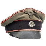 A Third Reich SS Panzer NCO’s or enlisted man’s peaked cap, with pink piping, metal badges and fibre