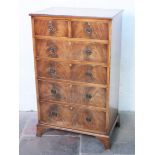 A mahogany chest of drawers with splayed legs. H124cm