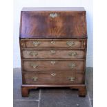 A Georgian mahogany bureau with brass handles and bracket feet. W67cm D46cm H101cm