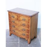 A good quality reproduction Georgian style chest of drawers with brushing slide and splayed legs.