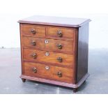 A Victorian apprentice chest of drawers with glass handles. H46cm