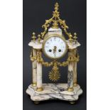 A French gilt metal clock, the movement striking on a single bell and stamped 'Japy Freres',