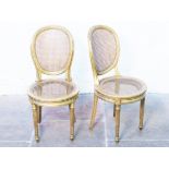 A pair of French gilt wood and bergere chairs, both with brass label Krieger Paris. H86cm