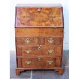 A George I style walnut bureau. W65cm D41cm H96cm