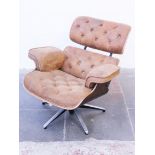 A Charles and Ray Eames style lounge chair. H76cm