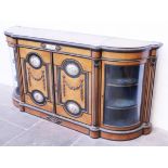 A Victorian amboyna and ebonised credenza having Sevres style porcelain panels and gilt metal