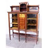 An Edwardian Art Nouveau mahogany display cabinet with marquetry panel. W153cm D43cm H194cm
