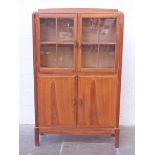 An Arts and Crafts walnut bookcase designed by Paul Matt for Brynmawr Furniture circa 1930s. W93.5cm