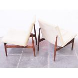 A pair of Danish(?) afromosia lounge chairs. W61cm D69cm H75cm