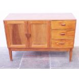 An Arts and Crafts walnut sideboard with visible dovetail joints. W131cm D46cm H92cm