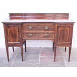 An Edwardian inlaid mahogany inverse breakfront sideboard. L152cm D62cm H105cm