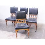 A set of four Gothic Revival oak chairs attributed to Charles Bevan for Marsh, Jones & Cribb,