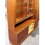 A Danish Poul Hundevad teak and sycamore lined bookcase. W139cm D43cm H196cm (Top can be disposed of