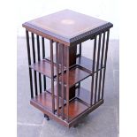 An reproduction inlaid mahogany revolving bookcase. W46cm D46cm H85cm