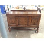 A 1920s oak sideboard. W137cm D55cm H97cm