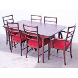 A McIntosh stained double extending teak table and six chairs. Min. table dimensions: L159cm D91cm