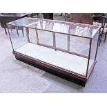 An early 20th Century shop display cabinet. W179cm D57cm H92cm