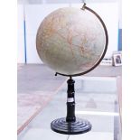 A German 12" terrestial globe. H62cm