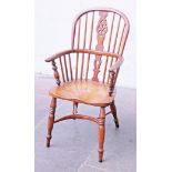 A yew and elm Windsor chair. H101cm