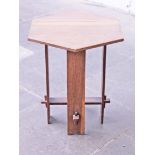 An Arts & Crafts style oak occasional table. H60cm