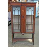 An Edwardian inlaid mahogany display cabinet. W90cm D34cm H164cm.