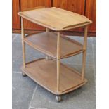 An Ercol light elm and beech three tier trolley. L72cm D46cm H74cm.