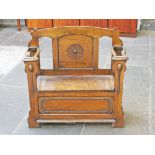 A 1920s oak bench with chest base and stick stand sides. W90cm D34cm H89cm.