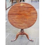 A George III mahogany tripod table. Diam. 76cm H70cm.