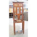 An Edwardian hall stand with cut out heart panels. W61cm D24cm H193cm.