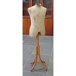 A dress makers dummy on bentwood stand. H155cm.