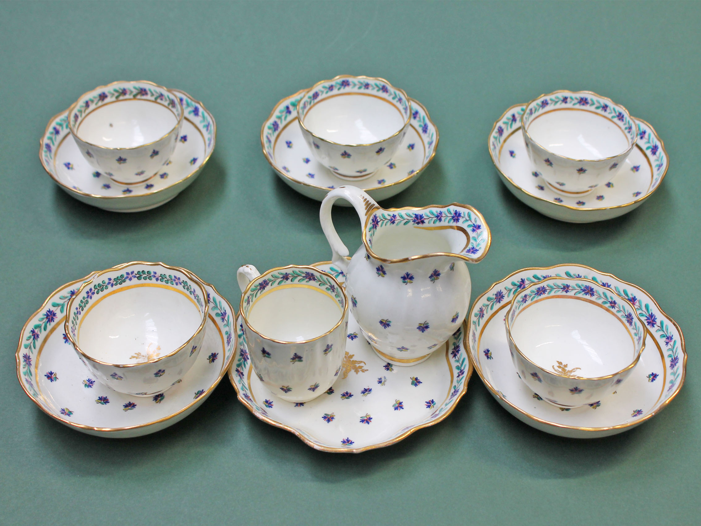 An English porcelain part tea set circa 1800 comprising five tea bowls and saucers, a cream jug, a - Image 2 of 2