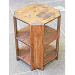 An Arts & Crafts style three tier oak table. H61cm.