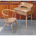 An Ercol light elm and beech desk and chair. Desk W69cm D46cm H96cm.