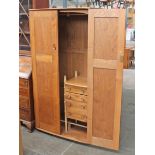An Ercol light elm and beech wardrobe with interior drawers. W91cm D56cm H181cm.