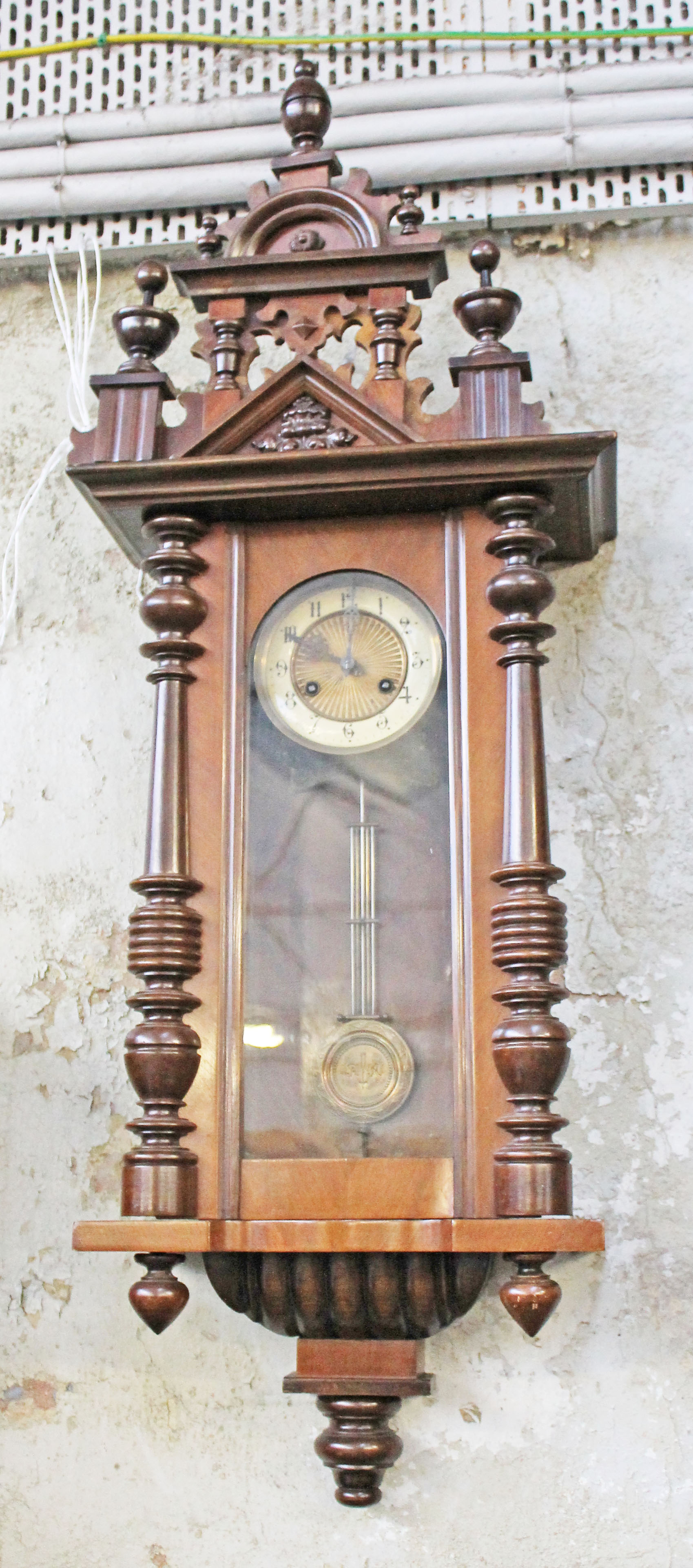 A 19th Century Vienna wall clock. L108cm.