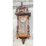 A 19th Century Vienna wall clock. L108cm.