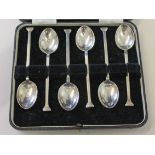 A cased set of six hallmarked silver tea spoons.