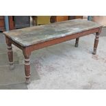 A Victorian pitch pine kitchen table with turned legs. L214cm D73cm H76cm.