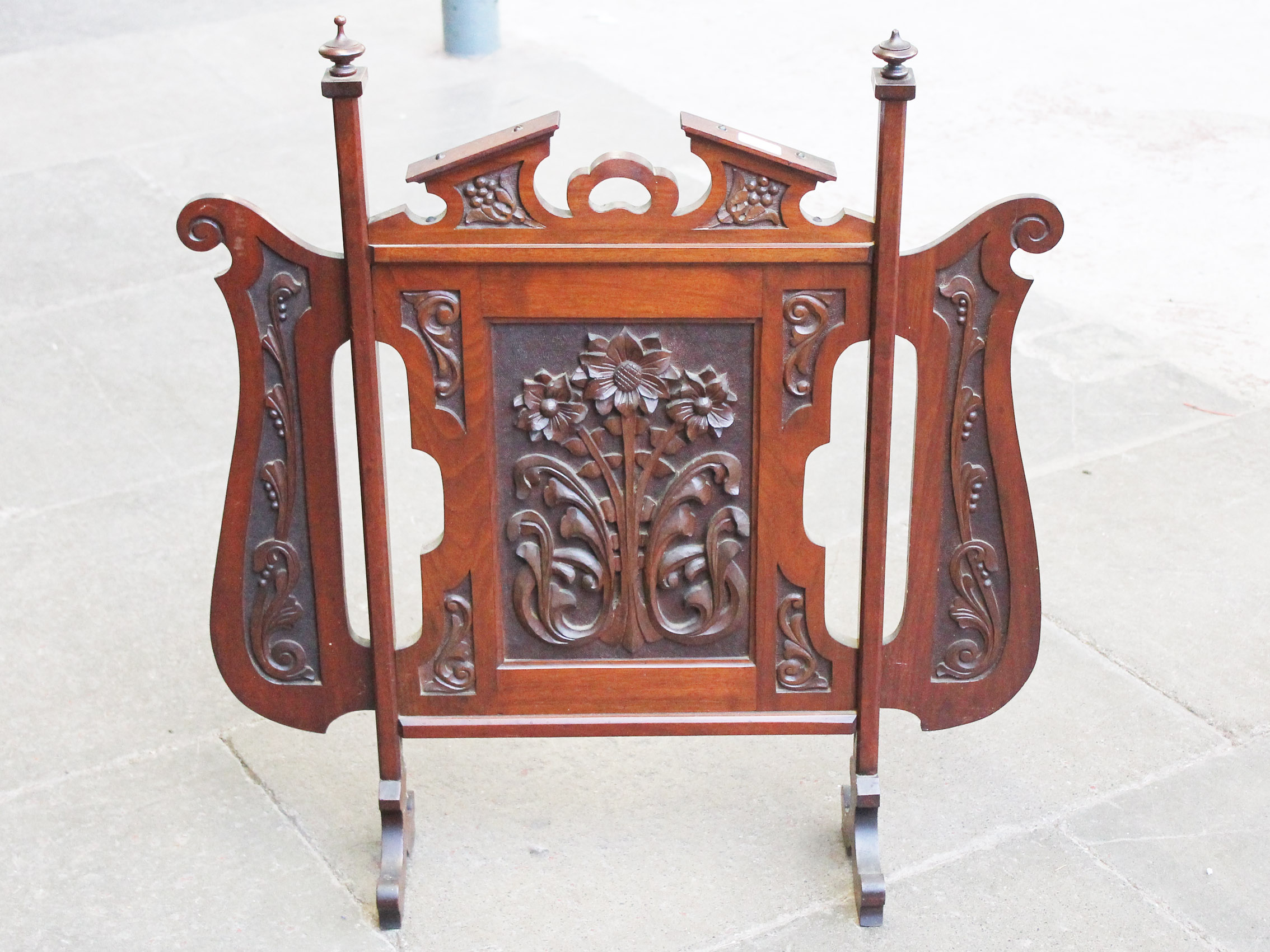 A carved mahogany fire screen circa 1900. L79cm.