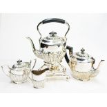 A four piece silver plated tea set. Condition - general wear to inlcude minor dings and scratches,