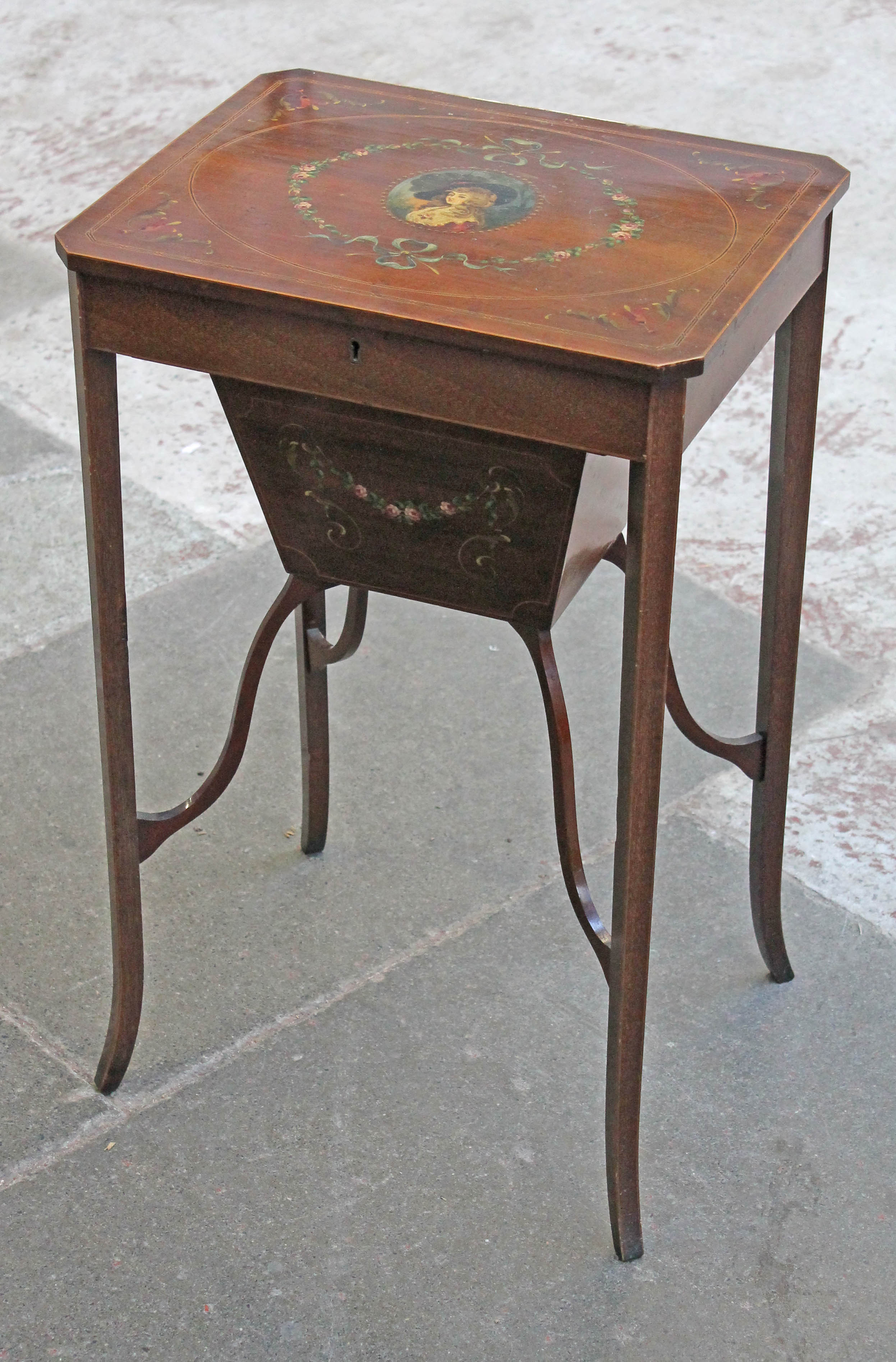 An Edwardian inlaid mahogany sewing or work table with hand painted portrait and floral