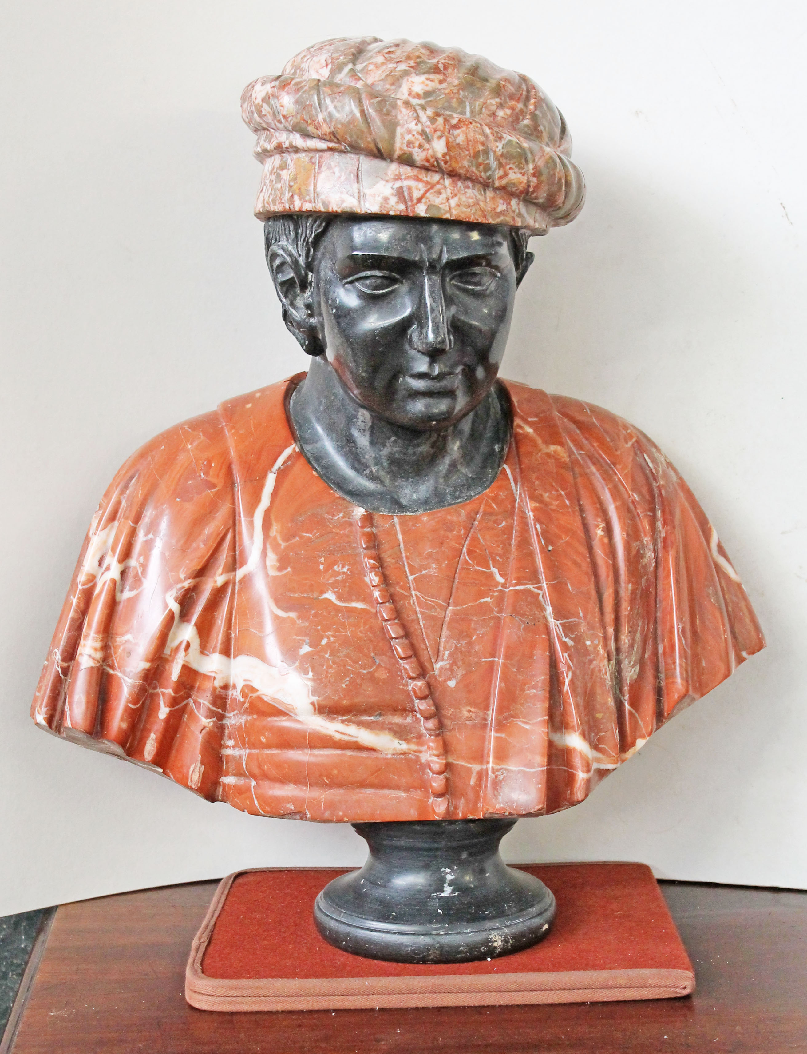 A late 19th Century three colour marble bust of a middle eastern/north African gent. H65cm.