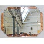 An Art Deco mirror. 92cm x 61cm.