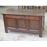 A 17th/18th Century carved oak chest. L128cm D57cm H69cm.