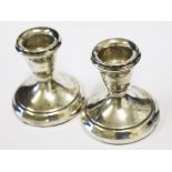 A pair of hallmarked silver candle stands, height 6cm each.